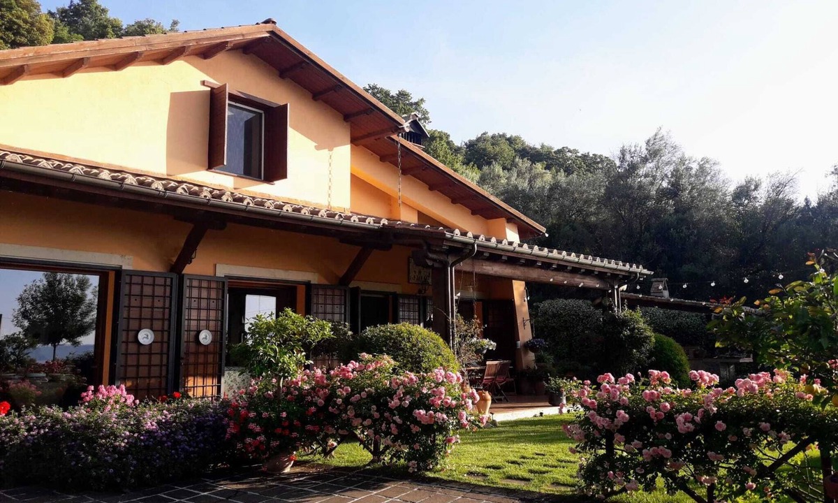 Lake Bracciano Villa | Breathtaking view of the lake and castle surrounded by holm oaks and oaks