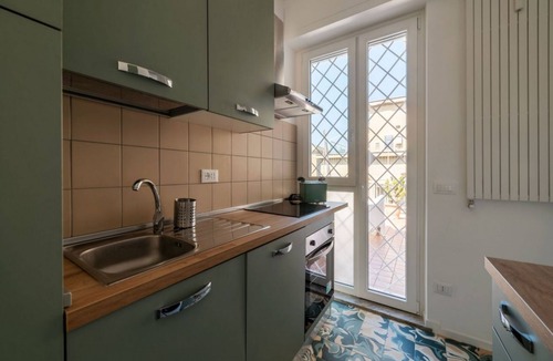 Universita Apartment | A comfortable and welcoming 48 square meters apartment, perfect for two people, located on the fifth and top floor of a building with an elevator (NOT accessible to disabled guests).The property is located very close to Rome Tiburtina Station (400 meters