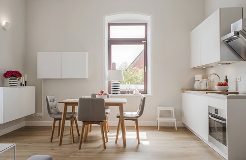 Lemkenhafen Apartment | Bright Stuuv – Comfortable Living with Sunny Terrace and Fireplace