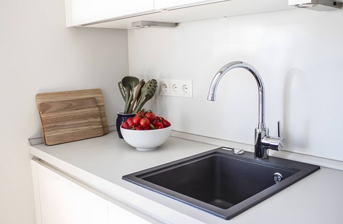 Lemkenhafen Apartment | Bright Stuuv – Comfortable Living with Sunny Terrace and Fireplace