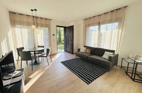 Alba Apartment | Elegant newly built apartment, located on the ground floor. Internally it consists of entrance on living room and kitchenette, double bedroom, twin bedroom, two bathrooms with shower. To complete the property large private garden and double outdoor parki