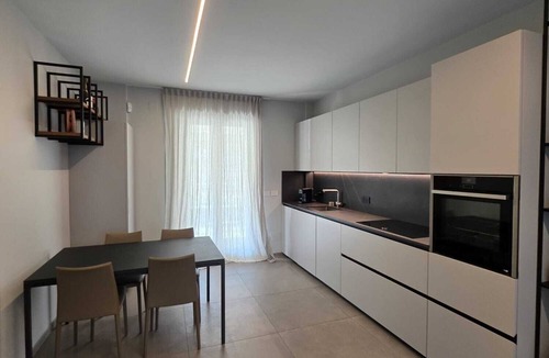 Lido di Fermo Apartment | Elegantly renovated beachfront apartment with a courtyard and parking space