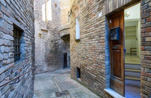 Urbino Apartment | GuestHost - A comfortable 64 square meters apartment, perfect for three people, located on the ground floor of a historic building with a private entrance.The property is located in the heart of Urbino's historic center (limited traffic zone). It also en