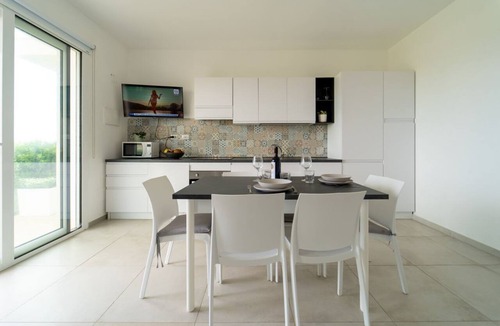 Pachino Apartment | GuestHost - Charming 75 sqm seaview apartment on two levels, for 5 people, located inside the renowned Borgo 84 residence, equipped with swimming pool and cycle path. The property is located just 3 km from the center of Marzamemi, one of the most fascina