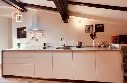 Historic Center Apartment | Harbor House. Relaxed and fun atmosphere with a view of the rooftops of Bologna.