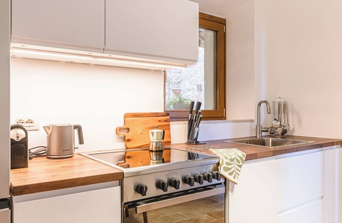 Scrofiano Apartment | Panoramic Views in the Heart of Tuscany, Historic Borgo Apartment with balcony.