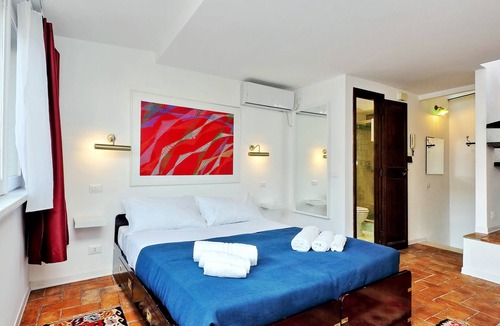 Monti Apartment | Romantic attic with a wonderful terrace, near the Colosseum