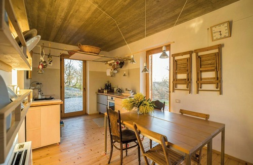 Montebuono House | Stone farmhouse among oaks in Maremma