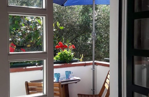 Quercianella Apartment | Stunning panoramic view of the sea, private garden, air conditioning.
