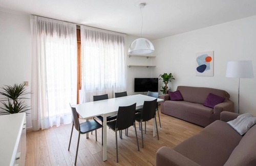 Santa Maria in Stelle Apartment | Stylish Lido Beach Apartment with Terrace, Shared Garden & Steps to the Sea