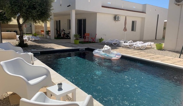 The pool and Sicilian sunsets along the coast of Scoglitti.