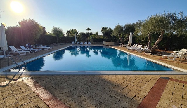 Villa Three Cocus in a tourist village, surrounded by greenery and near the sea